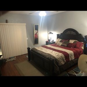 Dark brown bedroom set with California king bed.